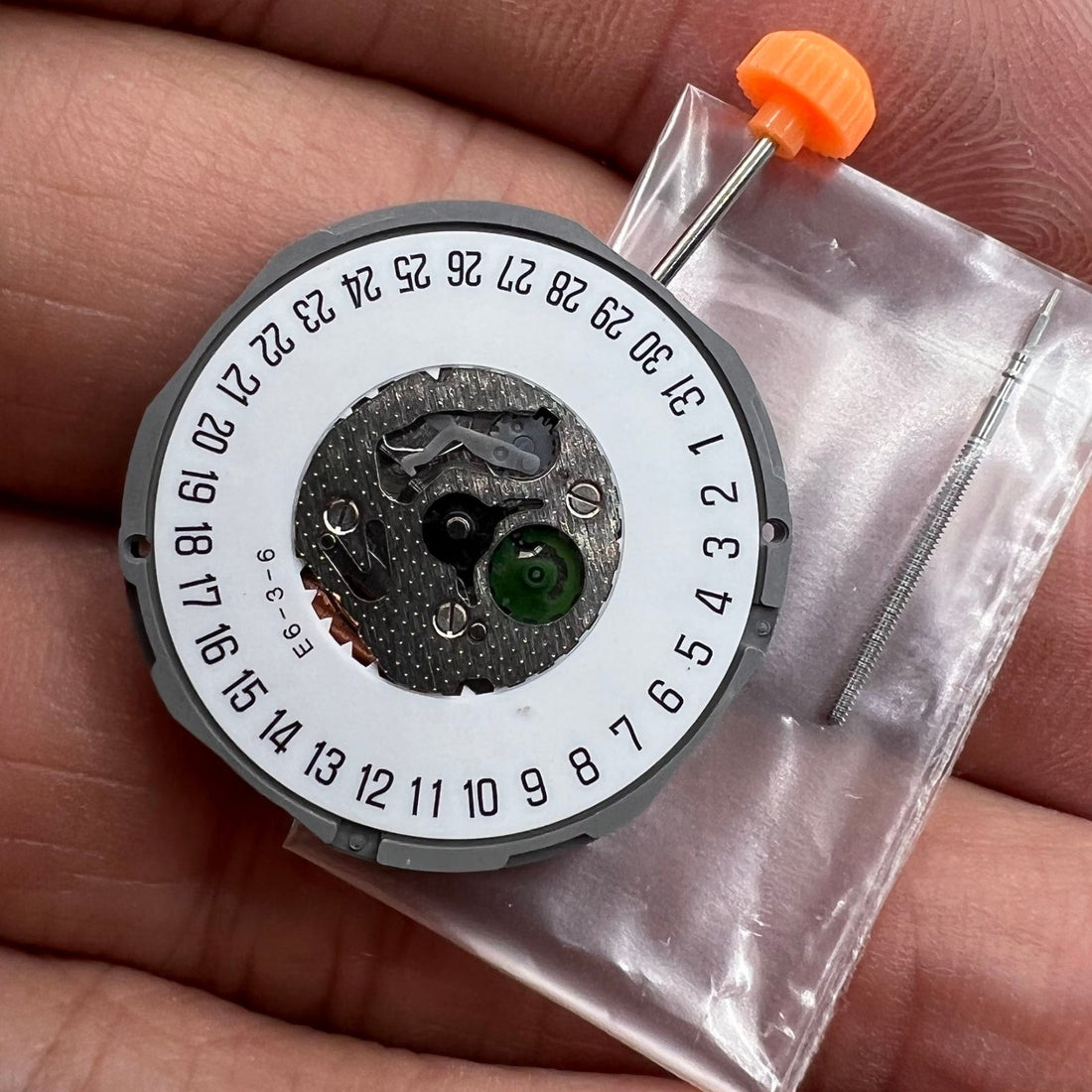 Miyota 1M15 quartz movement with date at 6, Japan-made watch accessory for precise timekeeping.