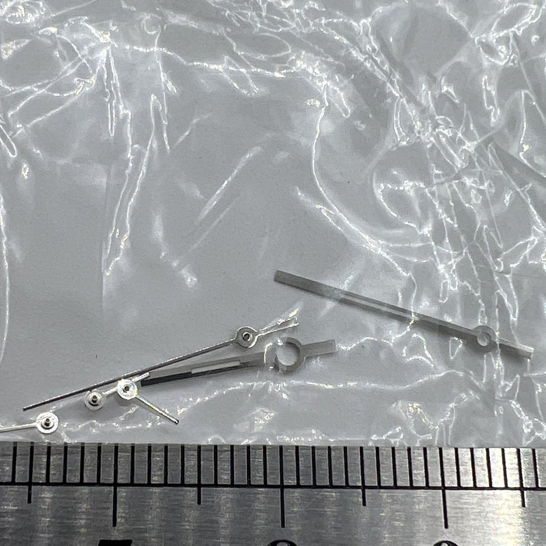 Silver trim watch hands compatible with Ronda 5030.D quartz movement, precise and stylish design.