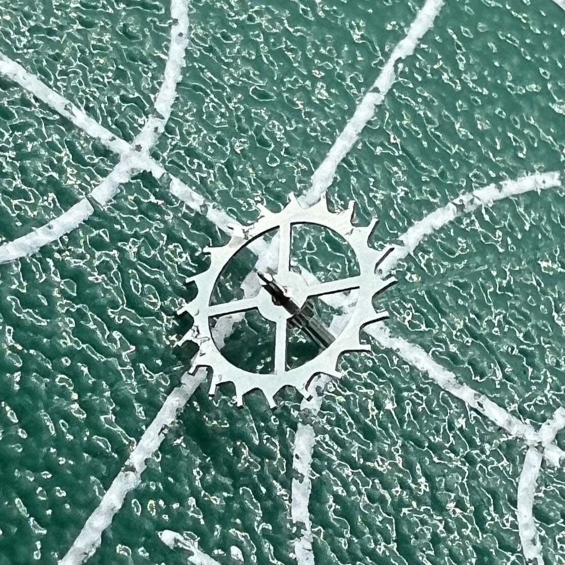Escape wheel for Dandong 7750 watch movement, precise replacement part for repair and maintenance.