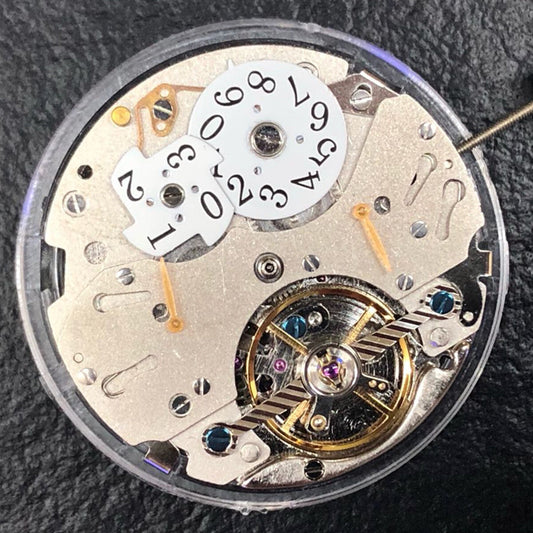China Made automatic watch with reversed balance wheel, big date at 12, precise mechanical movement.