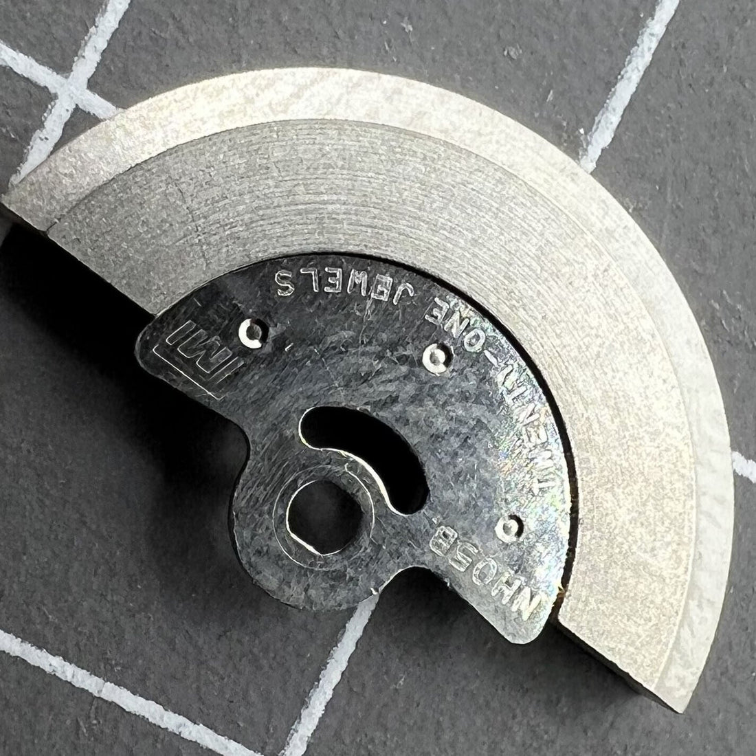 Rotor oscillating weight compatible with NH05 NH06 movements, enhancing watch accessory performance.