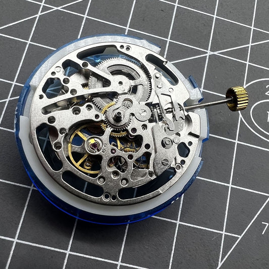 Dandong Silver watch accessory showcasing hollow automatic mechanical movement with second stop feature.