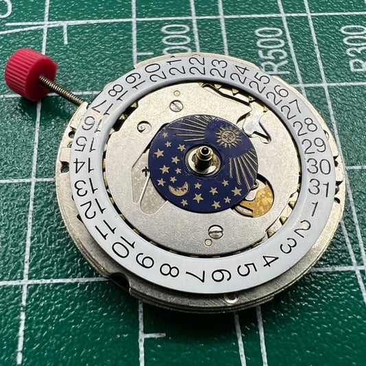 Wholesale ISA 1198 quartz watch movement with Swiss craftsmanship and moon phase display.