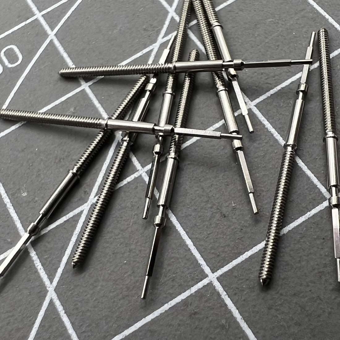 Swiss watch winding stem for Ronda 7004 movement, precision-made by Made brand for reliable time adjustment.