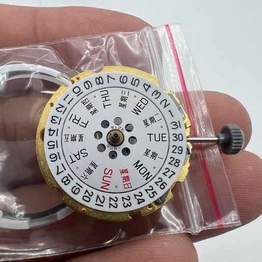 Golden Miyota Citizen 8200 automatic watch movement showing day and date functionality.