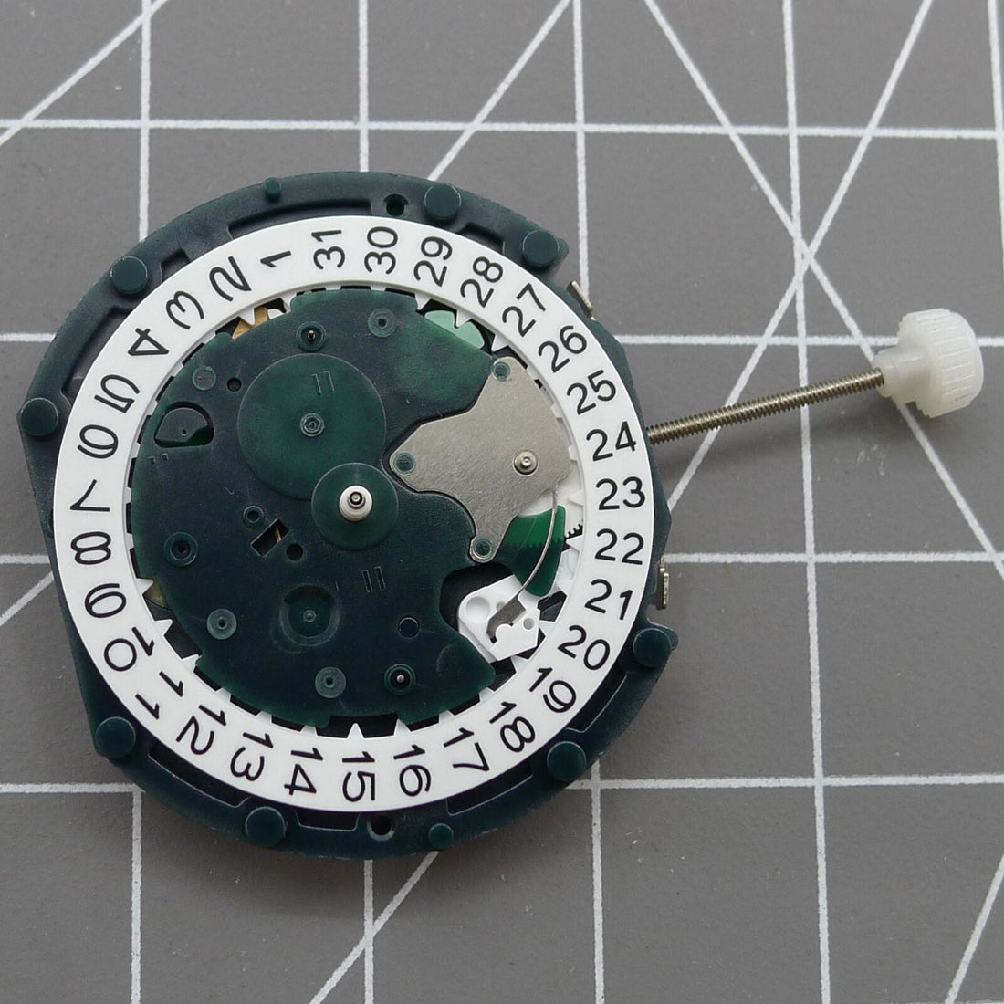 SUNON PE49 quartz watch repair part showing small second subdial at 6 o'clock and date window at 3 o'clock