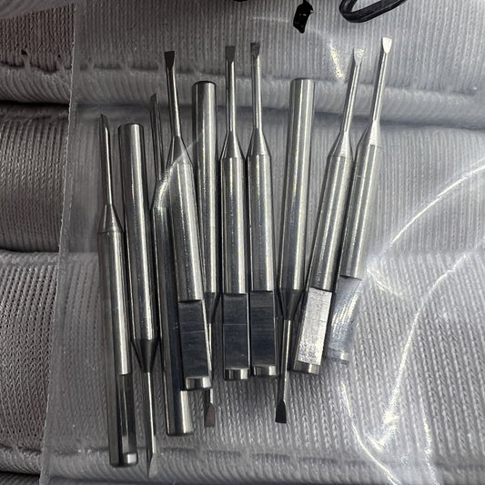 Ergonomic stainless steel screwdriver blades for watchmakers, precision spare parts for watch repairs.