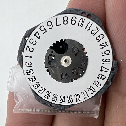 Hattori Epson TMI VJ42 quartz watch movement with date at 3 and 6, Japan-made precision.