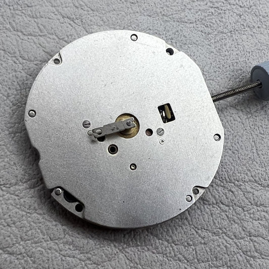 Close-up of Swiss Ronda 702 quartz watch movement showcasing precision craftsmanship and reliable timekeeping.