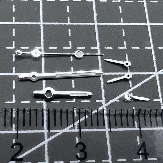 Silver arrow-shaped watch hands with green luminous trim, compatible with VD53 VD54 VD57 movements, 2 sets per pack.