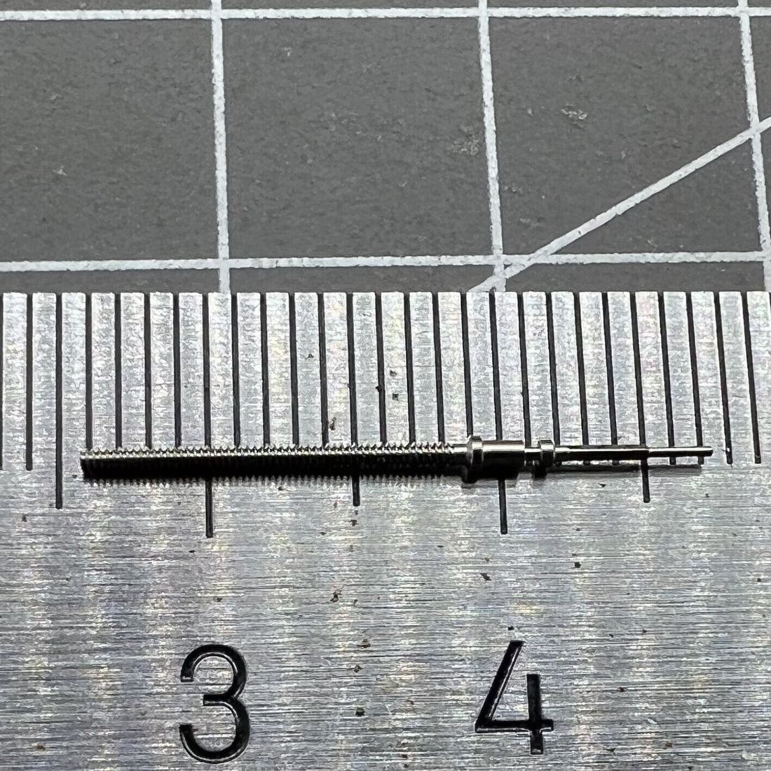 Watch winding stem for AP 3120 movement, precision replacement part for Audemars Piguet watches.