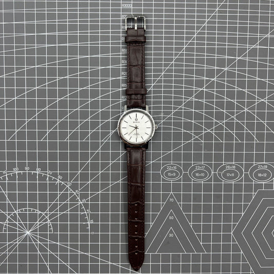China Baihua 37mm manual mechanical watch with silver dial, 19 jewels, and shock-resistant design.
