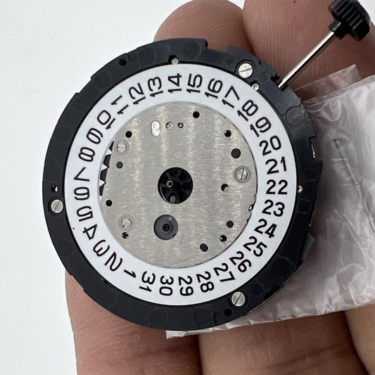 Miyota 6S20 quartz watch movement showing date at 3, three hands, and small second dial at 6 and 9 positions.
