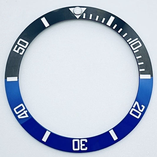 38mm black and blue GMT ceramic bezel with white font for 40mm watch case, branded for precision.
