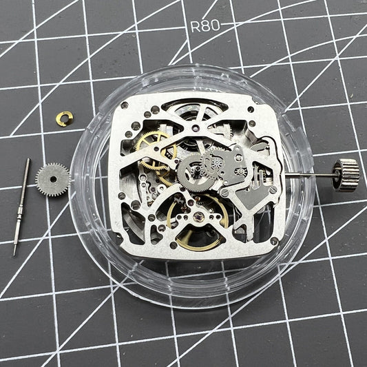 Tianjin Seagull ST25 square watch with silver 3-hand dial and visible automatic mechanical movement.