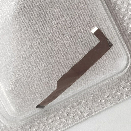 Close-up of Ref.9433 stop lever replacement part for ETA 7750 watch movement, precision spare component.