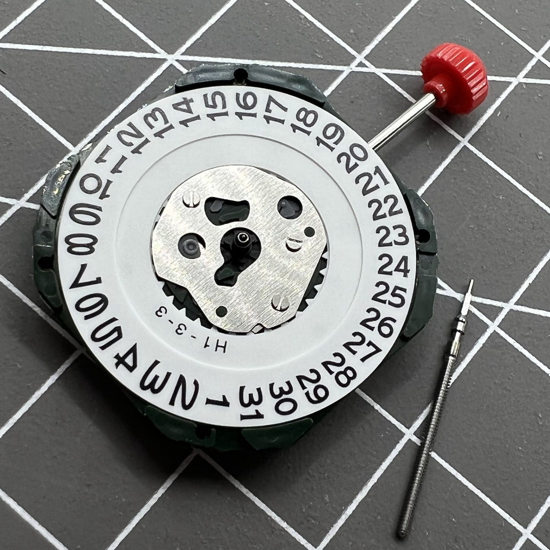 Miyota 2315 quartz watch movement with date at 3 and stem, precision Japan-made mechanism.