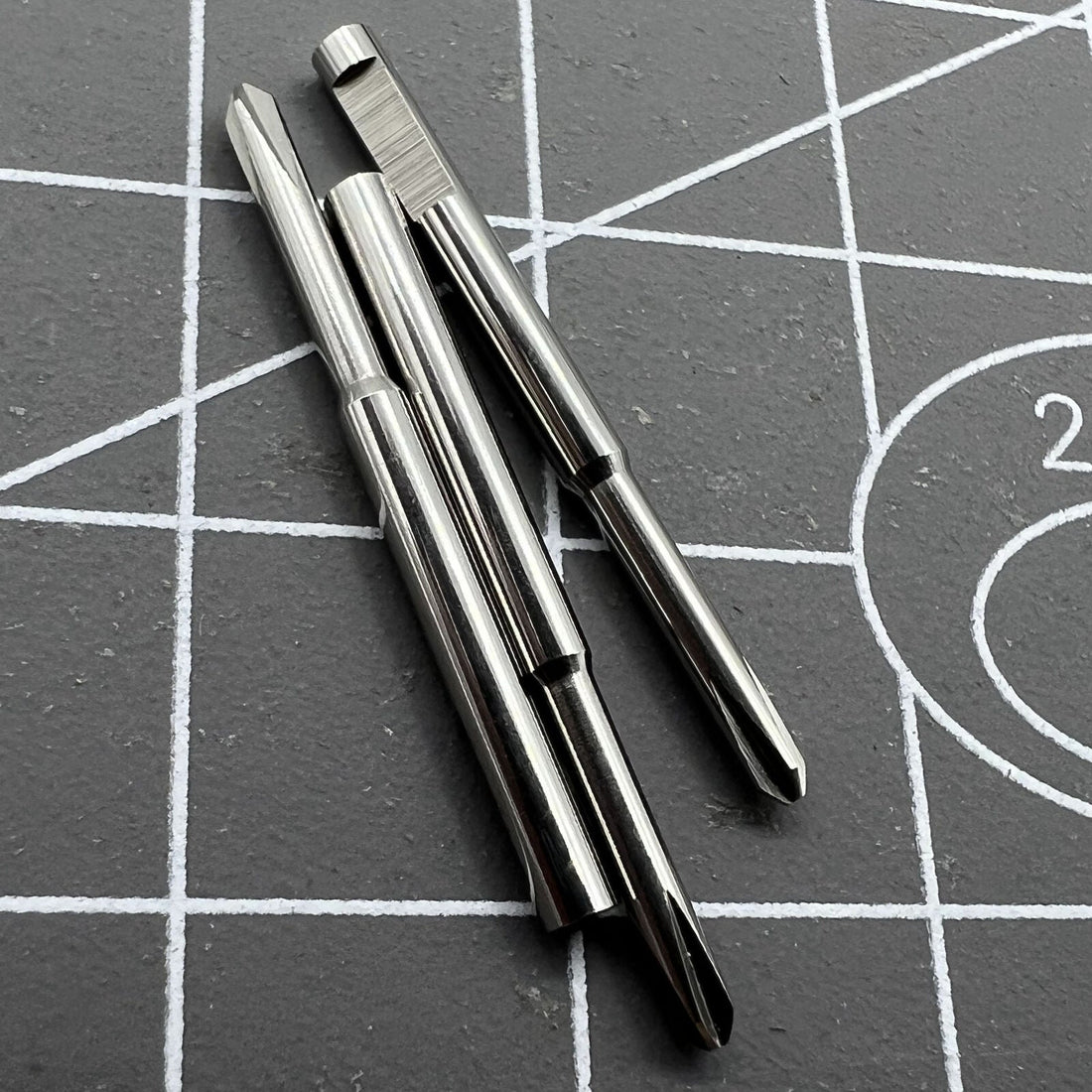 Ergonomic stainless steel cross blade screwdriver for precise watchmaker repairs.