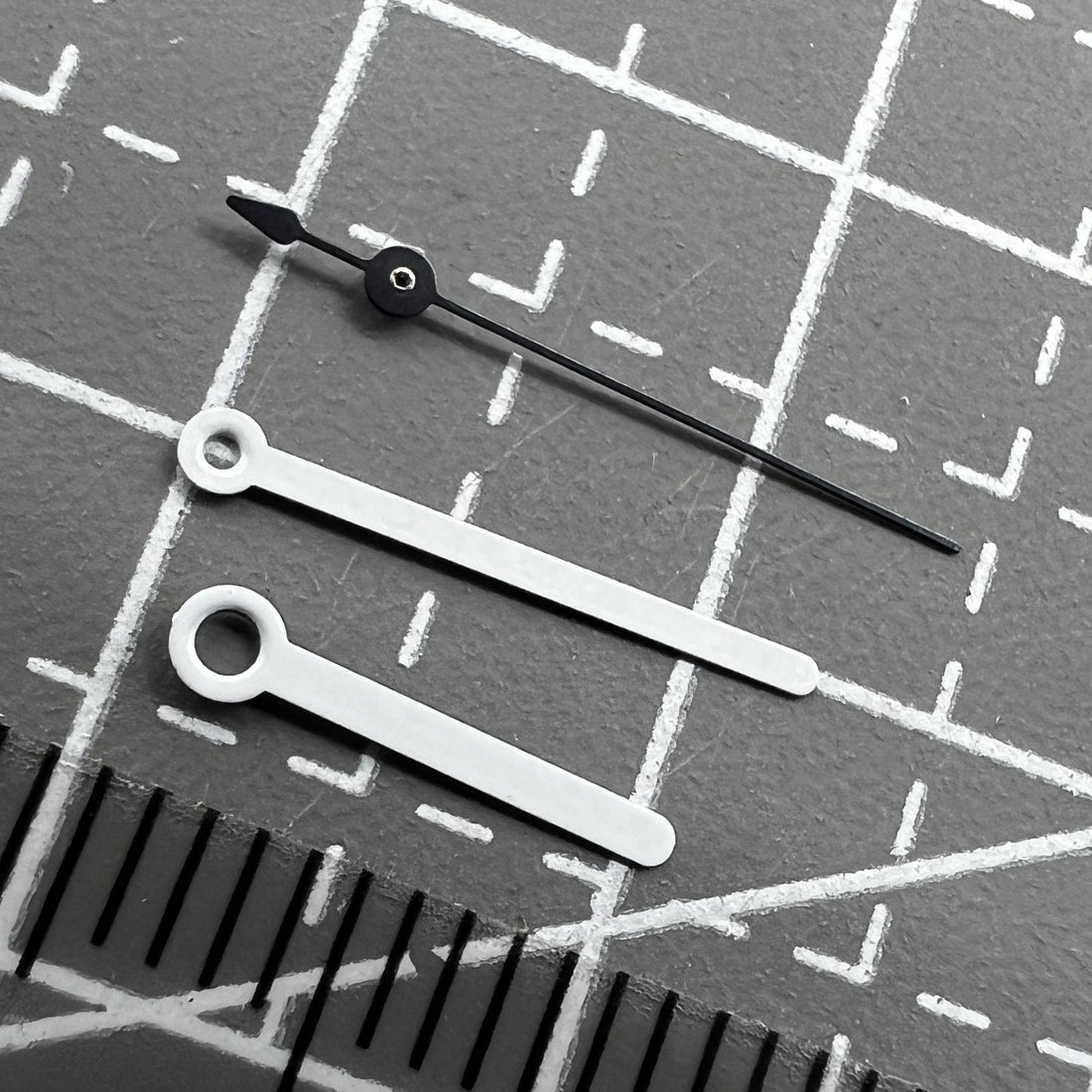 Set of 2 white 12mm pointed watch hands for Ronda 515 movement, perfect for precise repairs and upgrades.