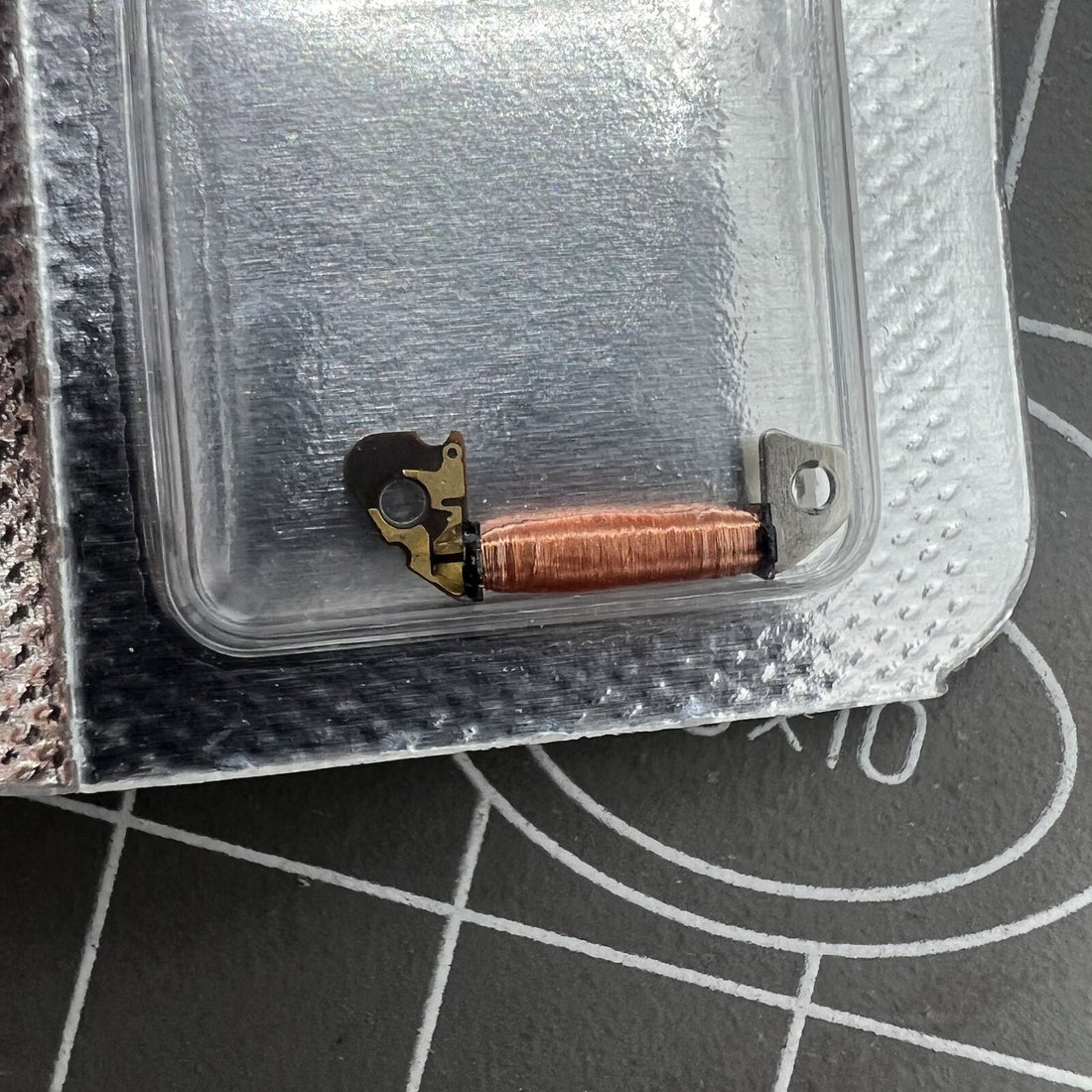 Circuit board coil for Hattori Epson VD53C quartz watch movement, precision replacement part.