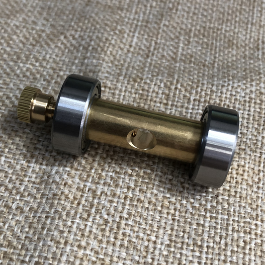 Copper watch repair screwdriver sharpener for precise jeweler and watchmaker tool maintenance.