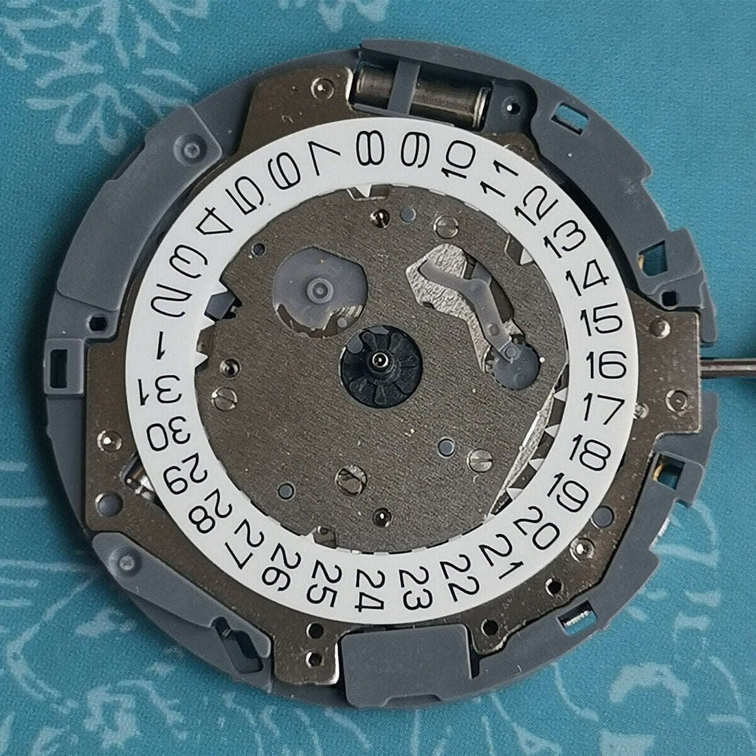 Japan Made Miyota OS11 quartz movement with white date wheel at 4 o'clock, watch part by Miyota.