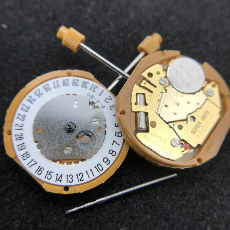 Miyota GN10 quartz watch movement showing date display at 3 and 6 o?clock positions