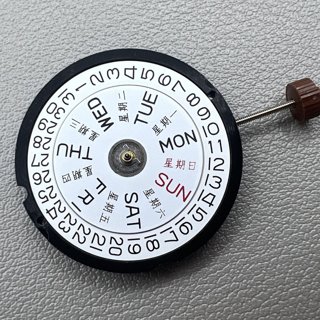 Swiss Ronda 517 quartz movement watch with English & Chinese day-date display at 3 o?clock.