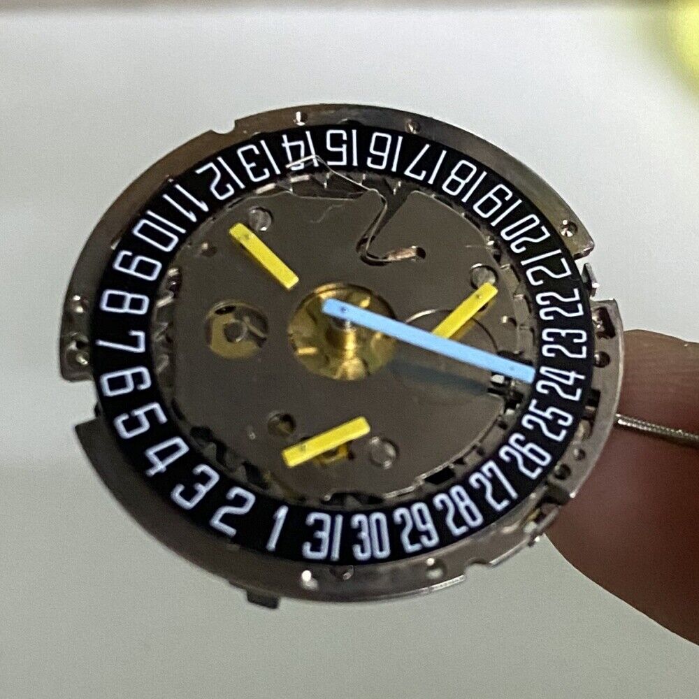 Swiss Silver ISA8171 watch with ISA 8161 quartz movement, date at 6, black dial, and six hands.