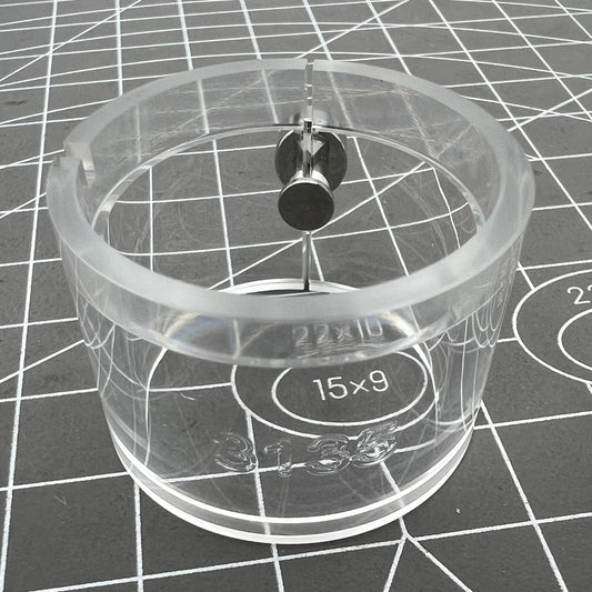 Clear RLX3135 watch movement holder showcasing internal components for precise repair work.