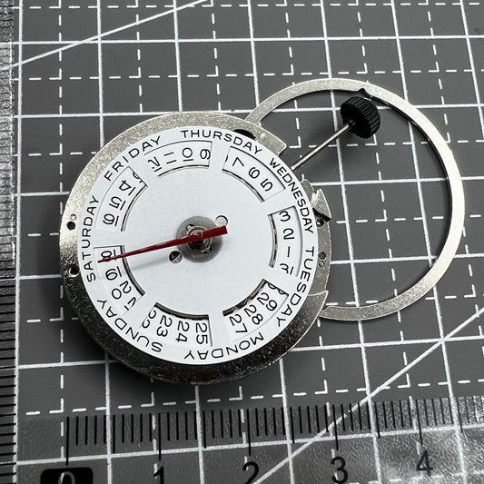 Automatic mechanical watch movement ST2147 with day display at 12 o'clock and date at 3, precise timekeeping.