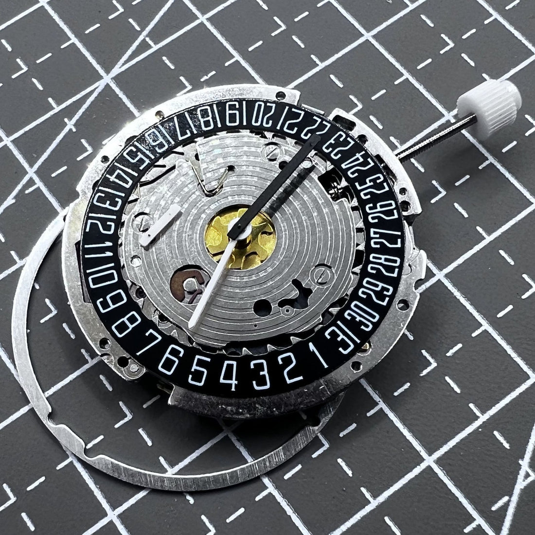 Black dial ISA 8171A quartz watch with 4 hands, date at 6 o'clock, Swiss brand detail