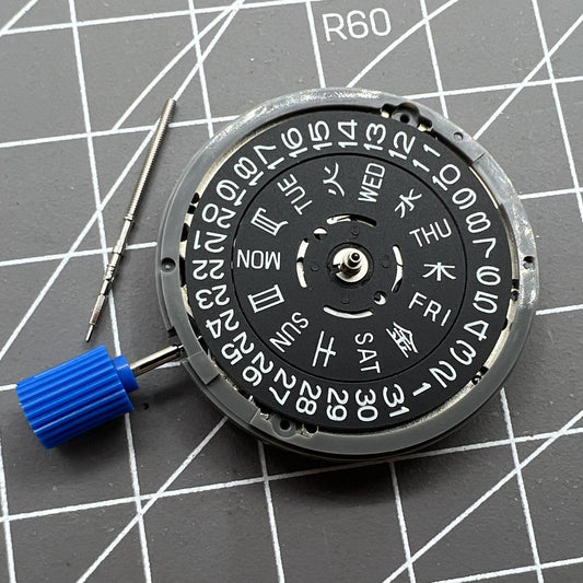 Miyota NH36A black automatic watch movement with green lume and three crown positions for precise timekeeping.