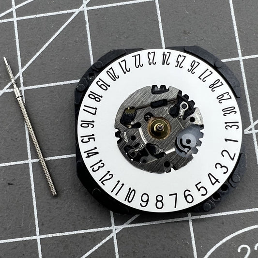 Hattori Epson TMI VX3K watch movement showing date display at 6 o'clock position, quartz precision.
