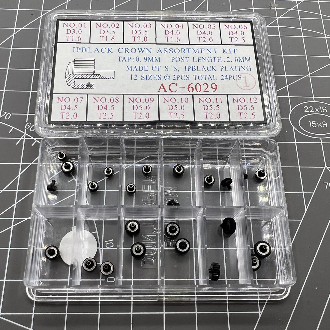 Black plated stainless steel watch crowns, 24 pieces in 12 sizes, perfect for watch repairs and customization.