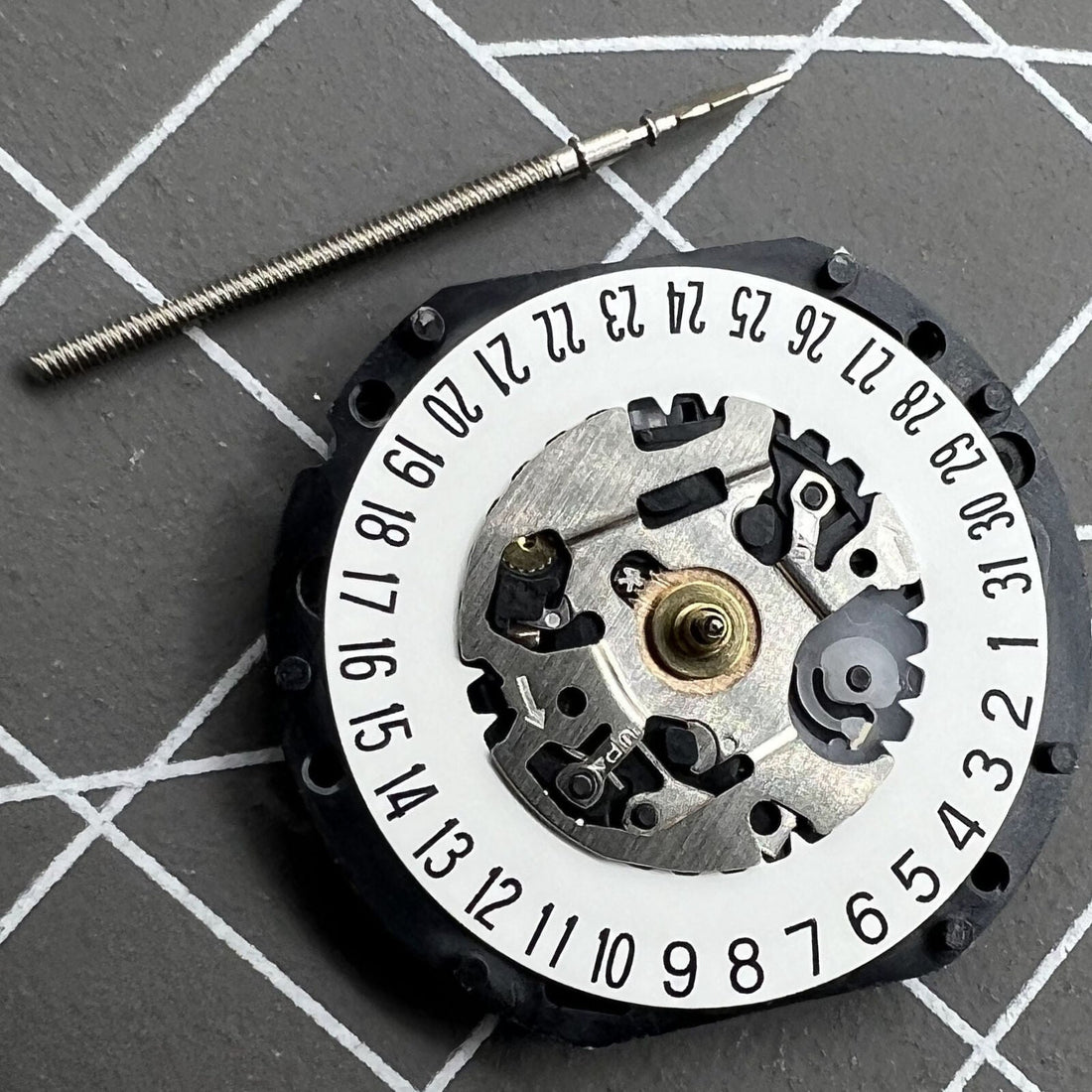 Hattori Epson TMI VX12 quartz watch movement with date at 3/6, Japan made precision parts