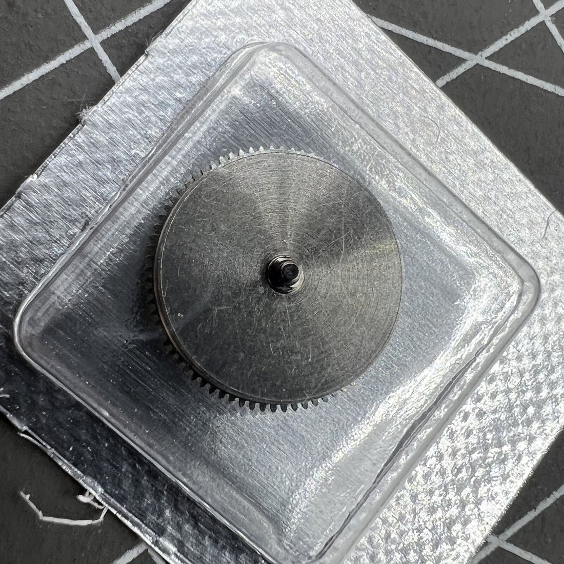 Silver barrel mainspring for Miyota 8200 8215 watch movement, compatible generic replacement part.