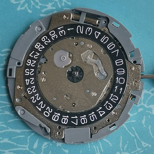 Japan Made Miyota OS11 quartz movement with black disk wheel and date at 4 o'clock, watch part.