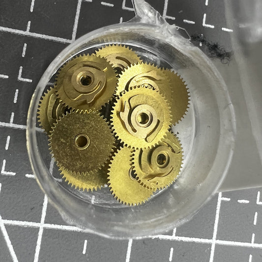 Set of 5 replacement date drive wheels for model 46943 watch accessories, precise fit for smooth calendar function.