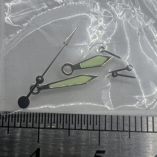 Silver-trimmed 11mm green luminous watch hands for Miyota 0S20, ideal for precise time reading.