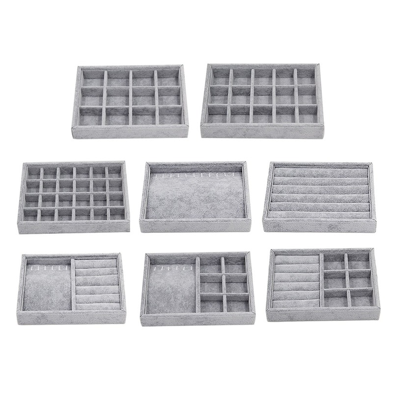 Gray velvet stackable jewelry organizer tray with grid compartments for elegant accessory storage.