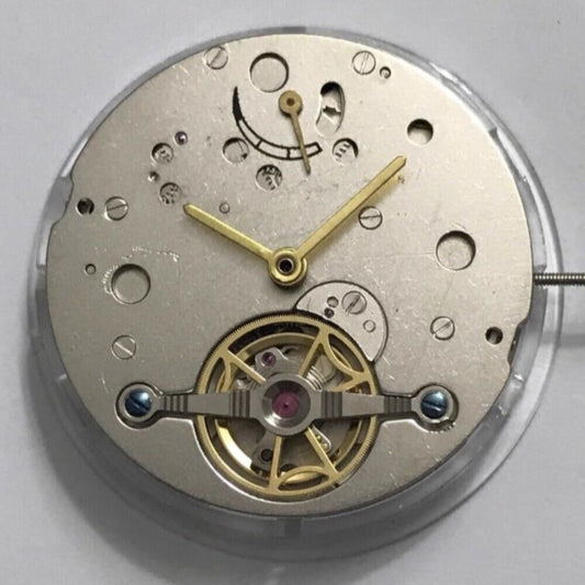 Shanghai Flywheel Movement watch showcasing kinetic energy display with bare balance wheel at 6 o'clock position.