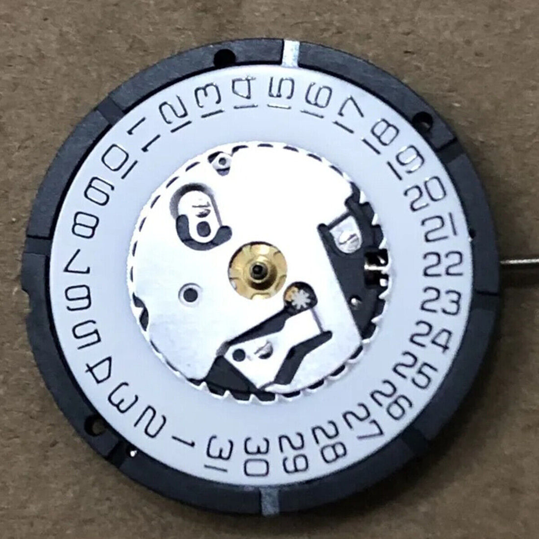 Watchmaker ISA 2320 white dial quartz watch with date window at 3 o'clock, perfect for repairs.