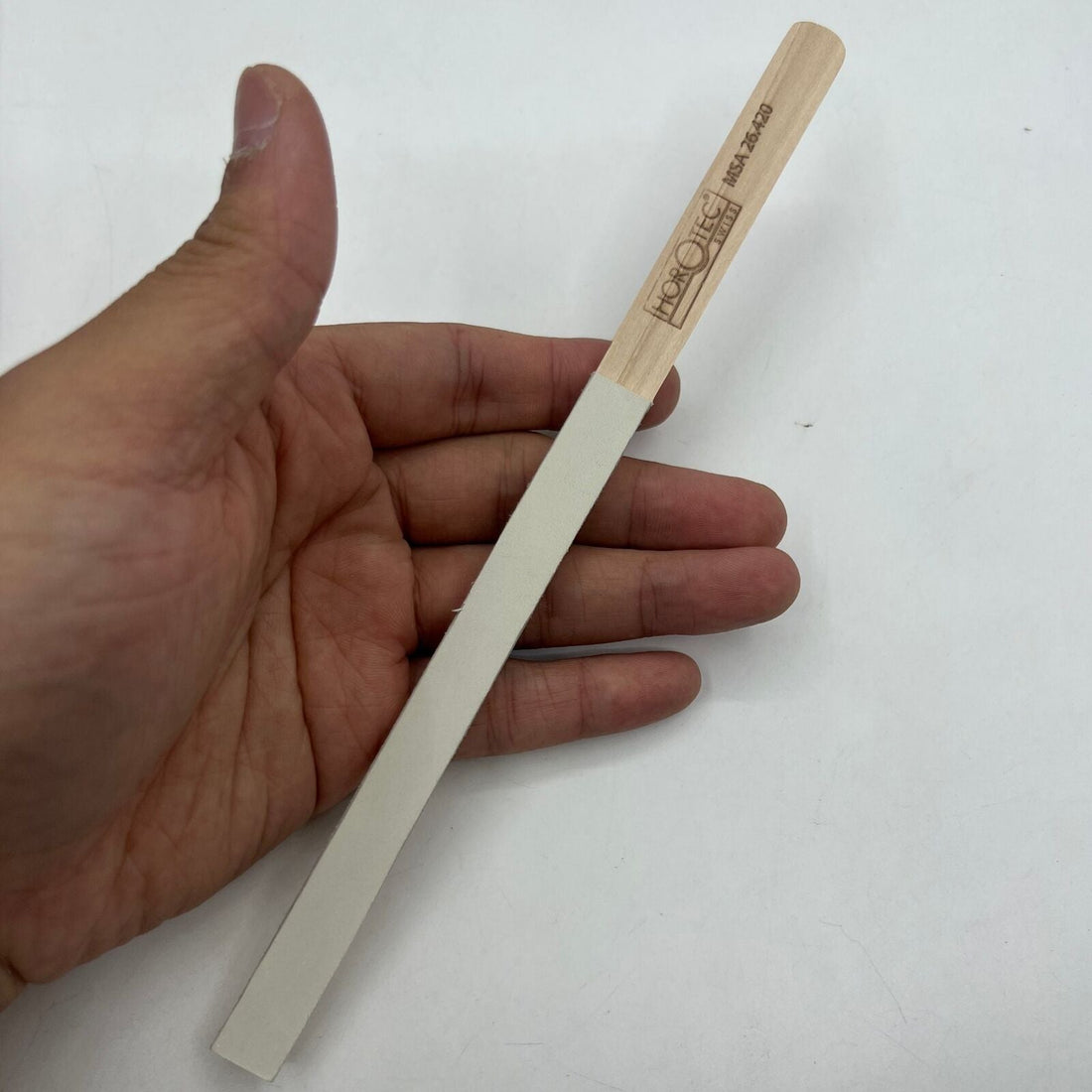 Horotec MSA26.420 white leather buff stick, essential Swiss watch accessory for polishing and cleaning.