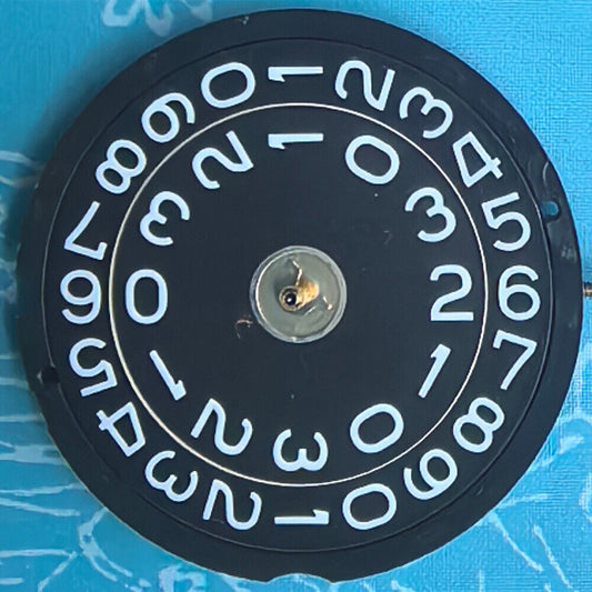 Swiss Made Ronda 519 quartz watch movement with black disk for precise timekeeping in watch repairs.