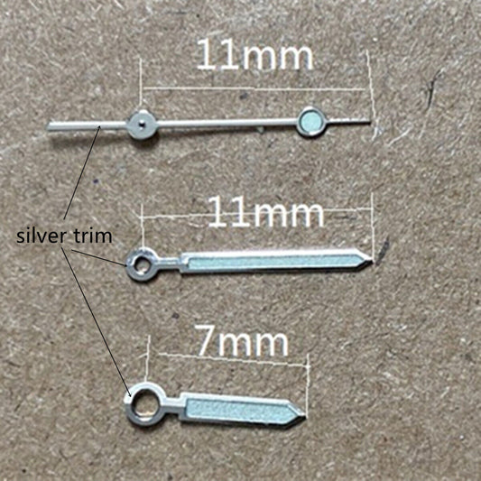 Silver-trimmed green luminous watch hands for Miyota 1M12 movement, enhancing readability and style.