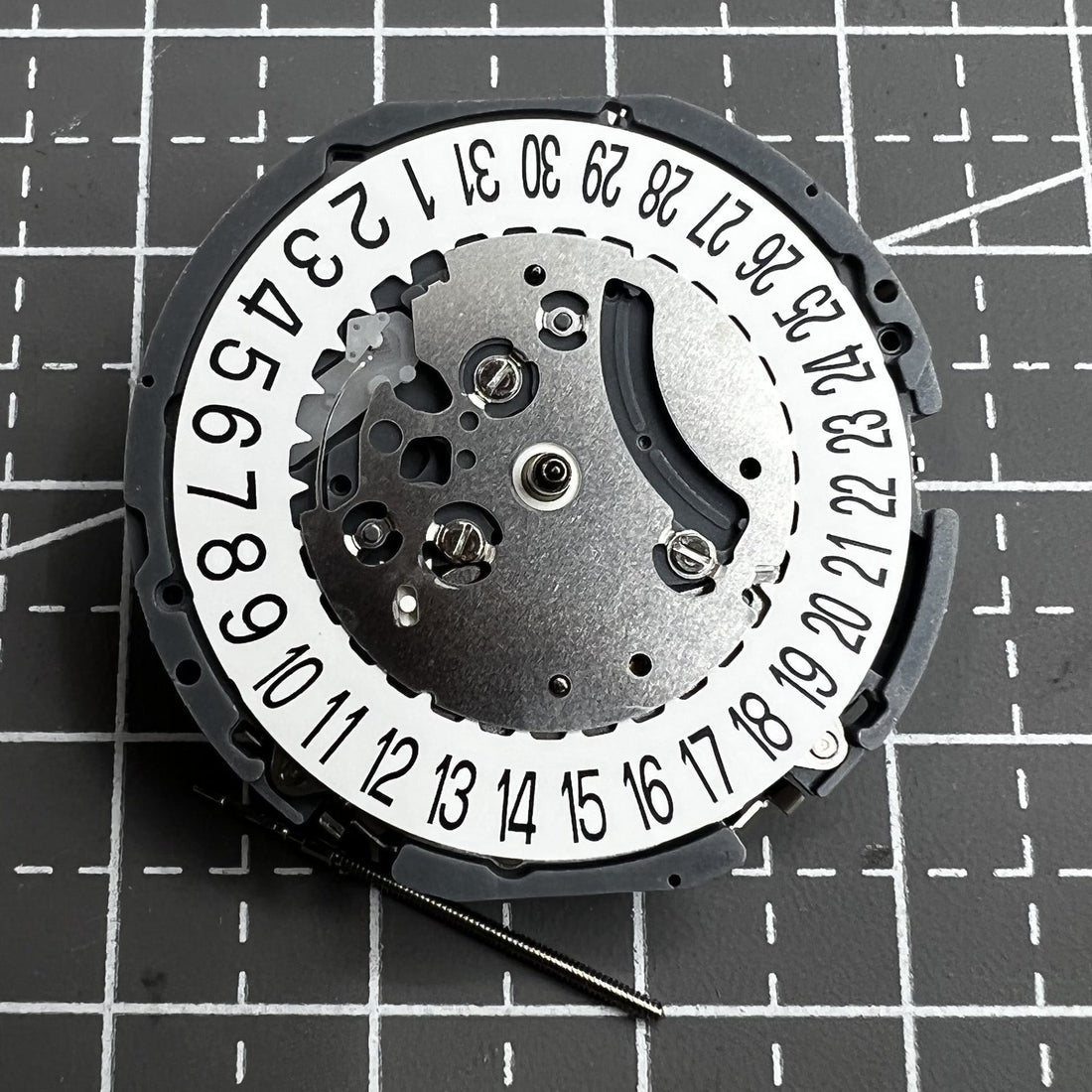 Japan Hattori VK64A quartz watch movement with date display at 6 o'clock, precise timekeeping.