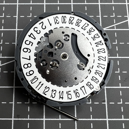 Japan Hattori VK64A quartz watch movement with date display at 6 o'clock, precise timekeeping.