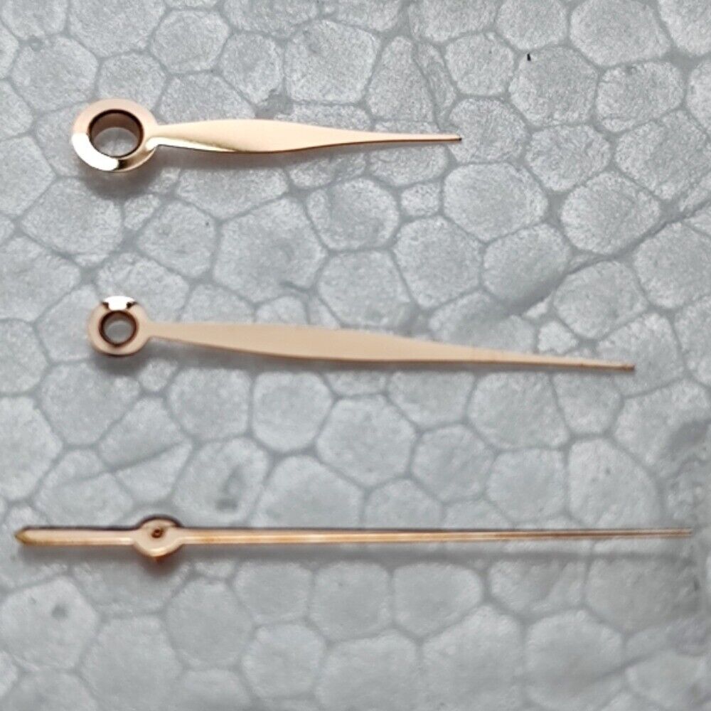 Polished rose gold leaf-shaped watch hands for LB06 movement, elegant design.