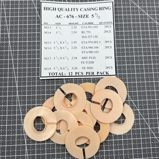 Set of 12 AC-676 watch movement spacer rings, 6-line size 5.5, for precise casing alignment.
